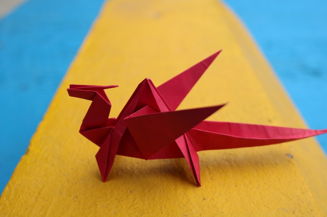 red origami dino